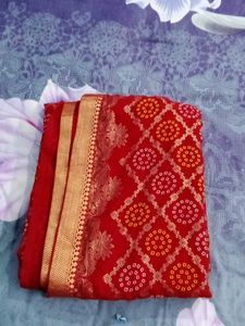 Vibrant Red Bandhani Saree with Gold Border