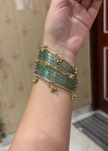 Elegant Teal Bangles with Golden Charms