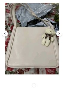 Chic Cream Shoulder Bag with Cute Charm