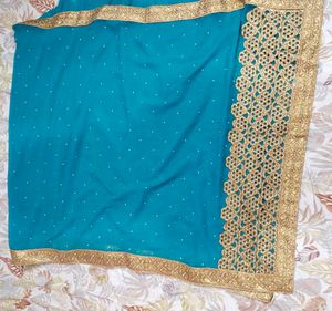 Teal Saree with Gold Border