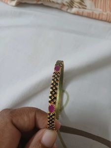 Elegant Gold Bangle with Black Stones