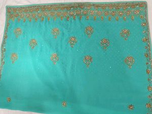 Exquisite Teal Saree with Golden Embellishments