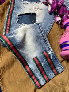 Ripped Jeans with Striped Detail