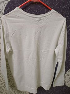 White sweater top with beautiful cut work....store