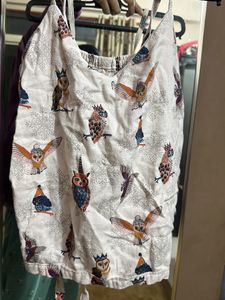 Sleevless Back Cut Design Top With Tie Knot Behind