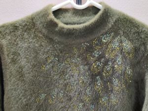 Imported women's fuzzy knit sweater with a high ne