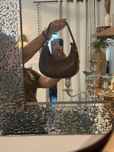 brown sling bag with belt