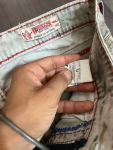 TRUE RELIGION WITH SMALL INK DOT AT BACK