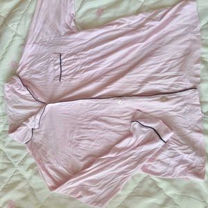 This Victoria's Secret satin pajama top features a