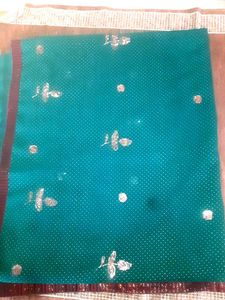 Ambroider saree without blouse.