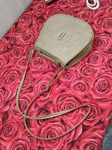 Gold sling bag