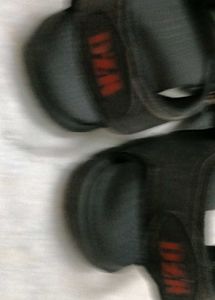 A Lightly Used Black Sandle
