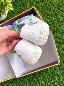 White Canvas Sneakers with Teal Laces