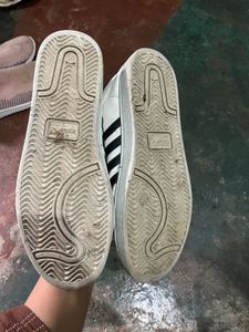 White Sneakers with Black Stripes