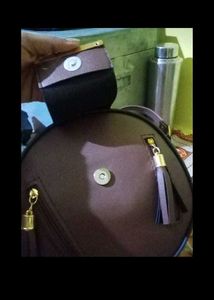 Stylish Round Maroon Handbag