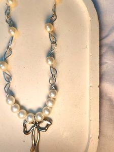 Elegant Pearl Necklace with Bow Charm