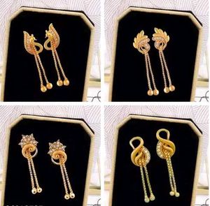 4 gold drop earrings in aesthetic design...