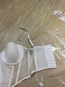 white corset top with silver chain detailing