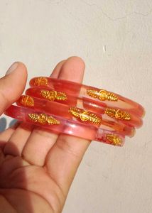 Elegant Red Bangles with Gold Accents
