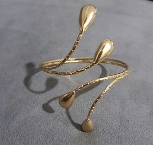 Elegant, Trendy Gold Spiral Arm Cuff