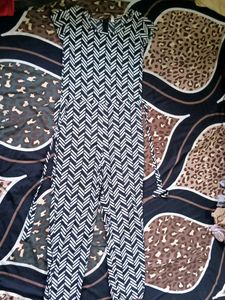 Name: Vivient Black Line Printed Front Knot Jumpsuits. Fabric: Crepe. Sleeves: Short sleeves. Patern: Printed. Size : S (Bust Size: 36 in, Length Size: 48 in, Waist Size: 36 in)