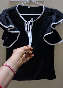 Elegant Black Top with White Accents