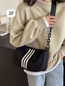 Sporty Black Crossbody Bag with White Stripes