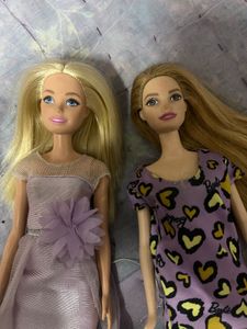 Two Barbie Dolls with Dresses