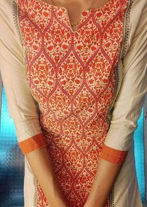 Elegant Cream & Orange Printed Kurti