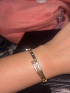 Elegant Gold Bangle with Roman Numerals
