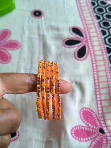 Set of Orange Bangles with Embellishments
