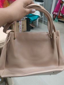 Stylish Beige Handbag with Pom-Pom Charm