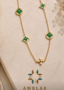 Elegant Gold Necklace with Malachite Charms