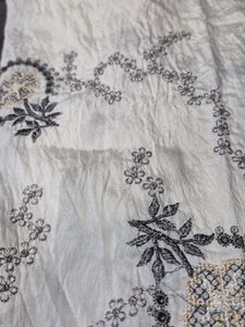 Embroidered fabric with solid matching fabri