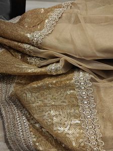 Elegant Beige Skirt with Embellished Hem