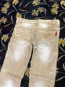 Stylish Beige Jeans with Graphic Print