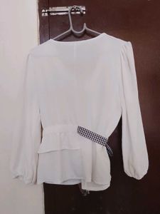 Chic White Peplum Top with Bow Accent