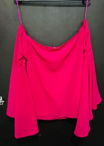 pink top with flared sleeves