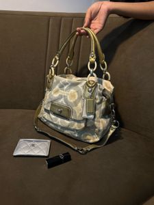 Chic Coach Shoulder Bag with Gold Accents