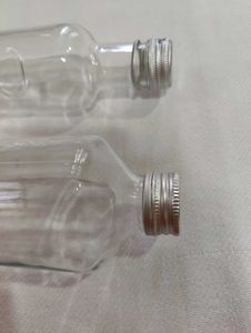 Set of Two Glass Bottles with Metal Caps
