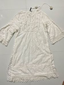 Elegant White Eyelet Dress with Pom Poms