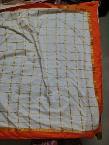 Cream saree with orange blouse