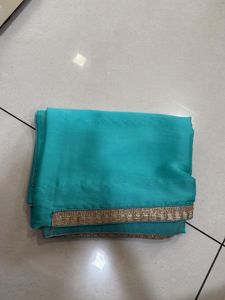 Elegant Teal Saree with Gold Border