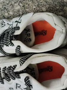 Stylish White Sneakers with Black Laces