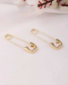 Women Safety Pin Design Golden Studs Earrings