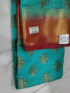 Beautiful Teal Saree with Gold Border