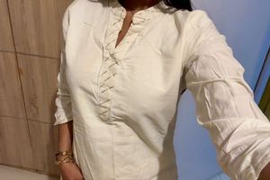 Elegant Cream Kurta with Embellished Neckline