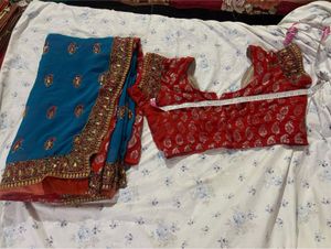 Beautiful Teal Saree with Red Blouse