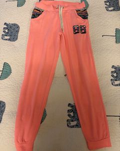 Pink Joggers with "06" Graphic