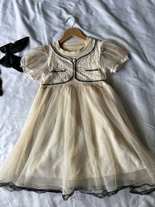 Elegant Cream Tulle Dress with Black Lace Trim